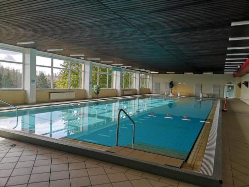 a large swimming pool in a large building at Apartment KY481 im Panoramic Hohegeiß in Hohegeiß