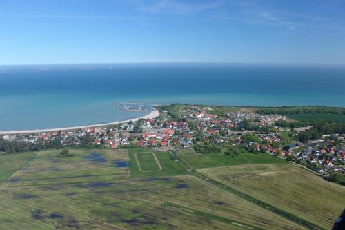 an aerial view of a town next to the ocean at Ferienhaus Stella in Glowe