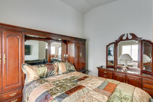 a bedroom with a bed and a dresser and a mirror at Pet-Friendly Escape with Grill, 11 Mi to Strip! in Las Vegas
