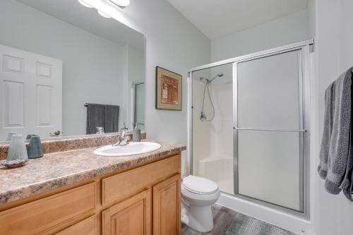 a bathroom with a shower and a sink and a toilet at Mesquite Vacation Rental Condo with Community Pool! in Mesquite