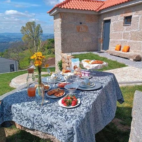 a blue and white table with food on it at Casa Nova de Senradelas in Marco de Canaveses