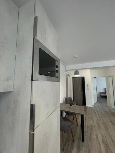 Телевизор и/или развлекательный центр в Comfort & Luxury Apartaments PNMresidence