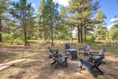 a group of chairs and a table in a park at Spacious and Quiet Pagosa Springs Cabin with Deck! in Pagosa Springs