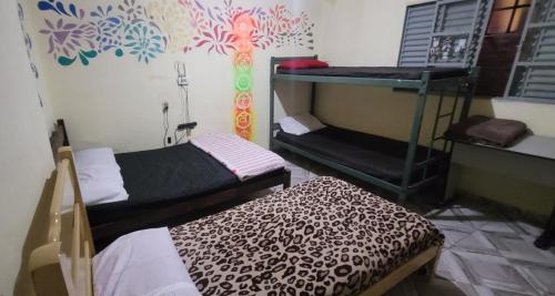 Ένα ή περισσότερα κρεβάτια σε δωμάτιο στο Casa da Luz stl Hostel