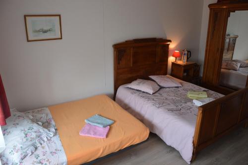 Кровать или кровати в номере Le Petit Chêne