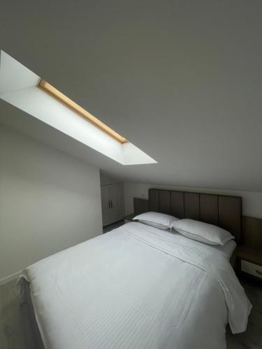 Кровать или кровати в номере Comfort & Luxury Apartaments PNMresidence