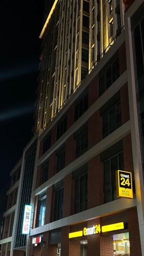 a tall building with a sign in front of it at Elbon The beach Haeundae in Busan