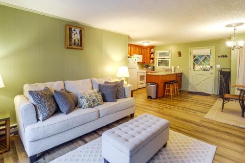 a living room with a couch and a kitchen at Walk to Slopes! Pet-Friendly Beech Mtn Condo in Beech Mountain