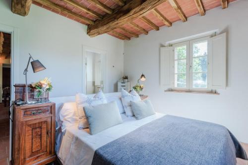 A bed or beds in a room at Casa Santo al Borghetto