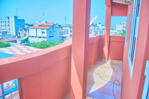 a balcony with a view of a city at Agim-Cotonou in Cotonou