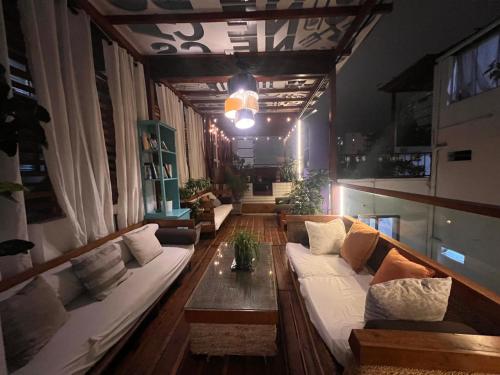 a living room with a couch and a table at La Casa del Viajero in Lima