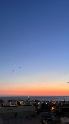 a view of a city skyline at sunset at Casa Janoub Morocco in Tamraght Oufella