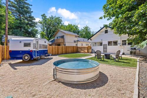 a backyard with a hot tub and a trailer at Downtown Bungalow with Geothermal Hot Spring in Boise