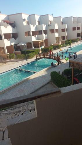 a large swimming pool in front of a building at blu lagon resourts in Ras Sedr