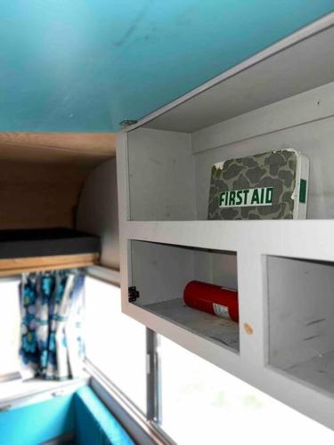 a first aid box sitting on top of a cupboard at Downtown Bungalow with Geothermal Hot Spring in Boise