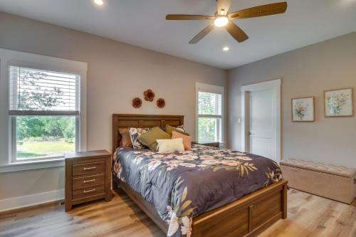 a bedroom with a bed and a ceiling fan at Secluded Barboursville Home with Covered Porch! in Barboursville