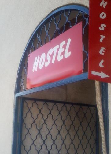 a sign that says nested on a wall at Hostel Marina Trogir in Trogir