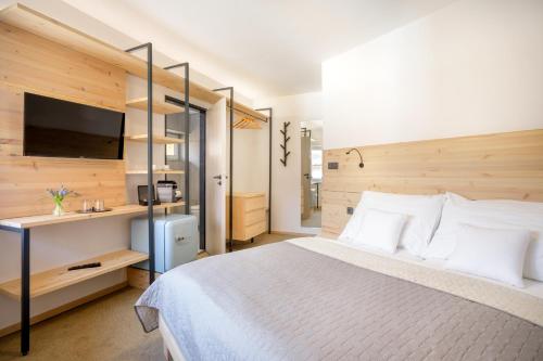 Ένα ή περισσότερα κρεβάτια σε δωμάτιο στο Ski & Spa hotel BELLEVUE