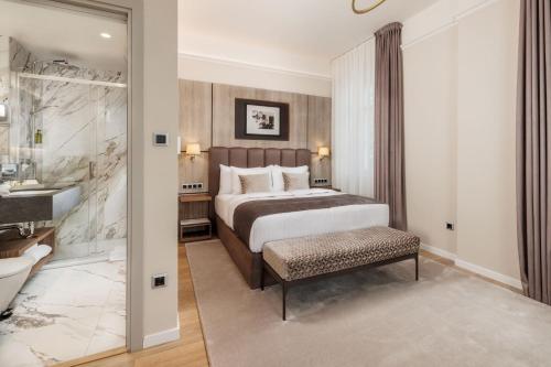 Postel nebo postele na pokoji v ubytování Anna Grand Hotel