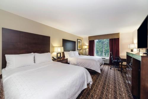 a hotel room with two beds and a window at Holiday Inn Express & Suites Aiken, an IHG Hotel in Aiken