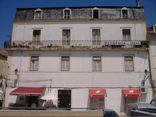 a large building with a window on the side of it at Residência Ideal in Coimbra
