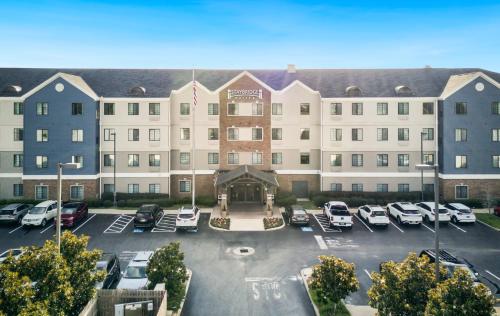 a rendering of a hotel with a parking lot at Staybridge Suites Gulf Shores by IHG in Gulf Shores