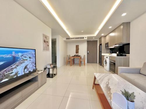 a living room with a large flat screen tv at Bangkok Asok Circle REIN Sukhumvit 12#2BR&3BR#Pool&Gym#Near Terminal 21 in Bangkok