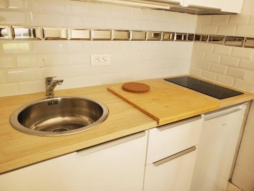 a kitchen with a sink and a counter at Studio hyper centre in Luchon