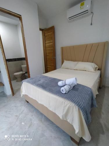 Ένα ή περισσότερα κρεβάτια σε δωμάτιο στο cabañas Brisas y Perla by AMAUNA