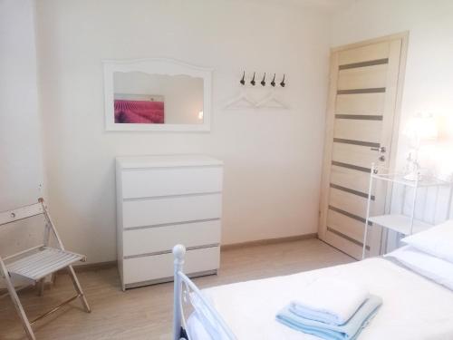 a bedroom with a bed and a mirror at Guest House Factory in Malacky