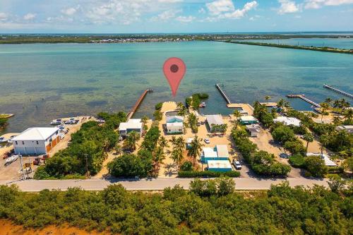 an aerial view of a resort with a pin in the water at Waterfront Captain House with Boat Basin & Ramp in Summerland Key