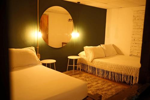 Säng eller sängar i ett rum på Siete Hierbas Hostal