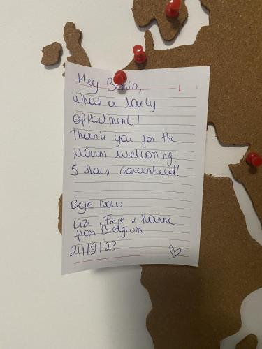 a note taped to a piece of paper on a wall at Apartment Centar Višnjik, Zadar in Zadar