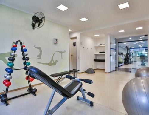 a gym with a cardio machine in a room at alto padrão itaim bibi in Sao Paulo