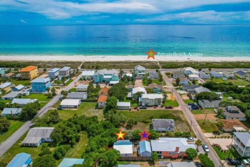 an aerial view of a resort next to the beach at The Coastal Cabana in Panama City Beach