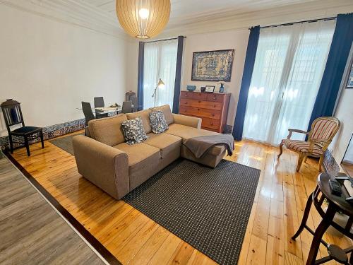 a living room with a couch and a table at Stay at Home in Lisbon in Lisbon