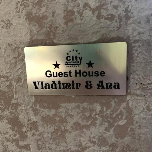 a sign for a guest house with a guest house vatican and azona at Guesthouse Vladimir & Ana in Pančevo