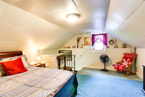 a bedroom with a bed in a attic at Historic Boonsboro Vacation Rental with Grill in Sharpsburg