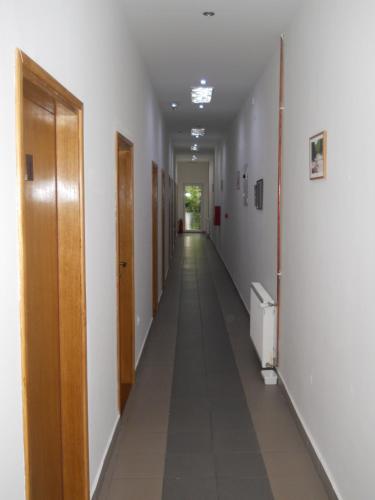 an empty hallway with a long corridor at Garni hotel Alma in Pirot