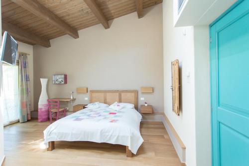 Postel nebo postele na pokoji v ubytování Agriturismo Castelli In Aria