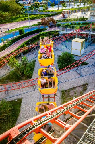 a group of people riding on a roller coaster at Serenity Alma Heights - Ex Serenity Fun City in Hurghada