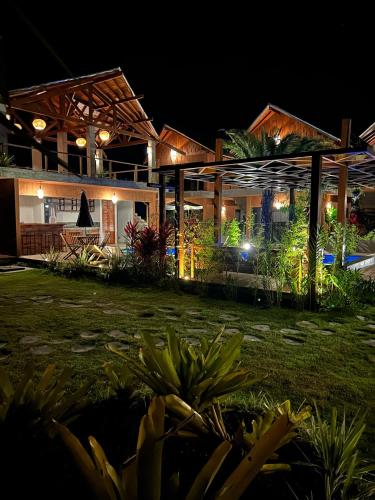 a house at night with the lights on at Barong EcoVilla in Barra Grande