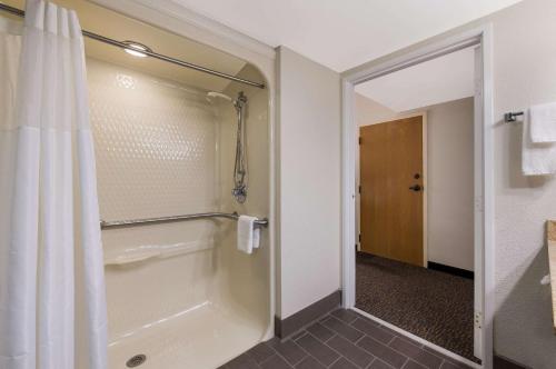 a bathroom with a shower with a shower curtain at Sleep Inn Northlake in Charlotte