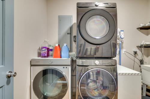 a washing machine and a dryer in a room at Deck and Fire Pits Immaculate Poconos Lodge! in Albrightsville