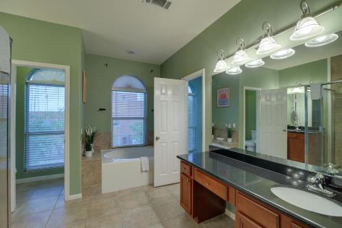a bathroom with two sinks and a bath tub at Houston Townhome By George Brown Convention Center in Houston