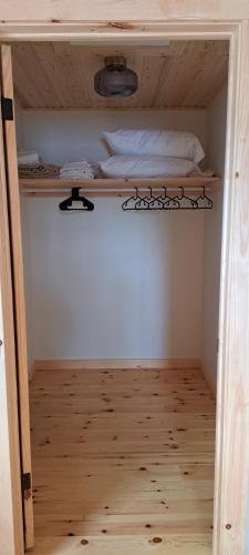 a bunk bed in a room with a wooden floor at Lochaber Homesteader Lodge in Antigonish