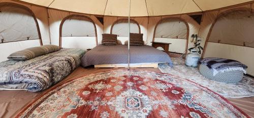 a bedroom with two beds in a tent at Secluded Glamping in Oley Valley 