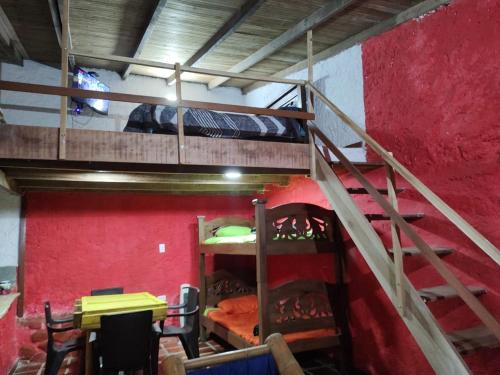 a room with two bunk beds and a staircase at Estadía SaraIsa in Cali