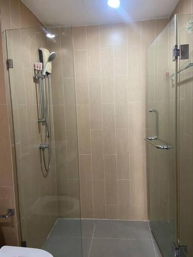 a bathroom with a shower with a glass door at Apartment near Central phuket in Phuket