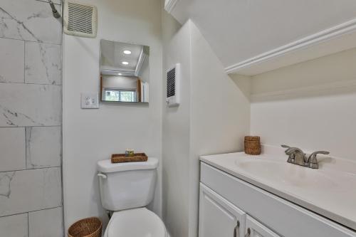 a white bathroom with a toilet and a sink at M20 Rentals Modern Apartment 2bd 1ba Centrally Located Salem, NH in Salem